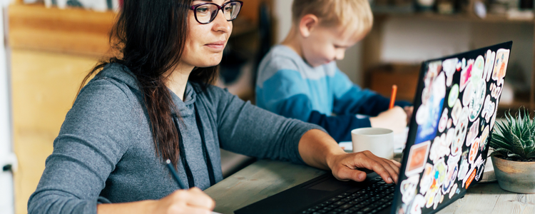 Mom Working From Home With Son at Side