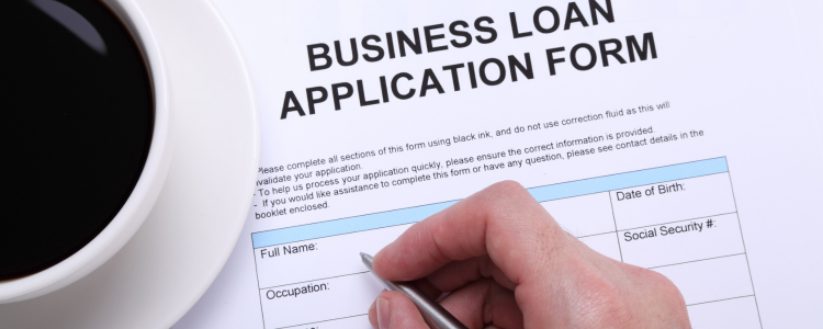 Man Completing a Business Loan Application